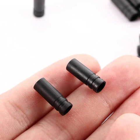 Close-up of 50 Piece Bike Brake Cable Ferrule End Caps Set, Plastic 4mm Shifter Housing End Caps, Black, Durable, Smooth Edges