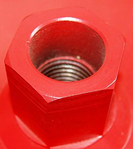 Red hexagonal metal core drill adapter with threaded inner bore.