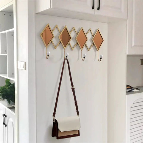 Real Deal Nordic Wrought Iron Wall Hooks For Coats And Keys Heavy Duty Build, hanging brown and white bag on decorative wall hook.
