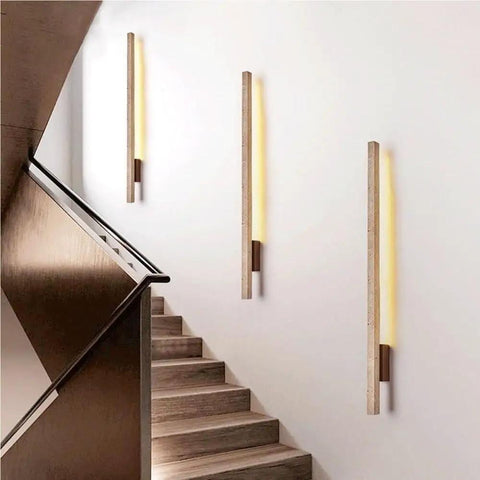 Linear Wall Sconce Wood Grain Strip Wall Light Slim Vertical Lamp Modern Minimalist Fixture Warm Lighting for Bedroom Living Room Hallway Background Wall Decor on stairwell wall.