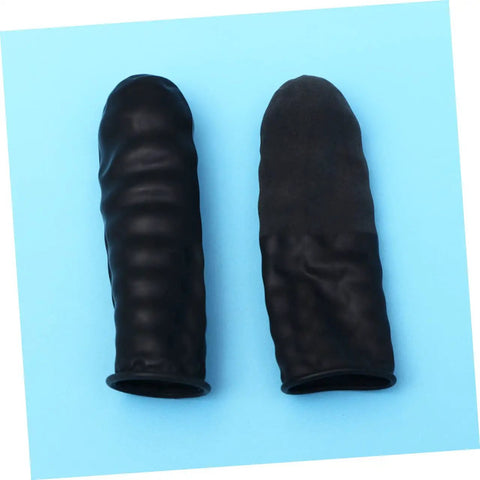 1000 Piece Black Latex Finger Sleeves Block Sneaky Sweat Smudges And Greasy Fingerprints From Messing With Pristine Hardware For Tough Shop Floor Crews And Weekend Gearheads Fixing Tight Builds, showing two latex fingertip covers on blue background.