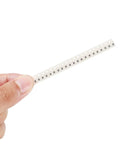 Hand holding a strip from the 0805 SMD Resistor Kit With 1500 Pieces 60 Values From 0 Ohm To 10 Mega Ohm One Percent Tolerance Great For DIY Electronics 0.125 Watt Rating 0805 Chip Resistors Surface Mount Assortment