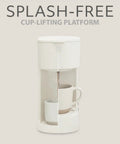 Front view of Eco Series Single Serve Coffee Maker For K Cup And Ground Coffee With Six To Twelve Oz Brew Sizes And Strong Brew Option Compact Coffee Machine With Removable Water Reservoir And Reusable Filter Made From Recycled Plastic showing splash-free cup-lifting platform.