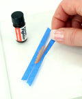 Applying Rear Window Defroster Grid Repair Kit DIY Easy No Fuss Fix For Failing Defogger Lines Color Matched To Most Grids With Nearly Invisible Finish on damaged grid.
