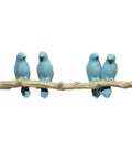Slick Wall Mounted Hooks For Coats Keys Hats And Towels Housing A Rad Bird Motif in blue on a branch for home organization.