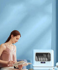 Woman reading near Pretty Slick Countertop Dishwasher Fully Automatic Stainless Steel with LED display.