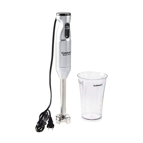 Heavy Duty Corded Stick Blender With Two Speed Toggle Makes Silky Smoothies And Creamy Broths In A Jiffy With Whisper Quiet Motor In Sleek Silver next to a clear measuring cup.