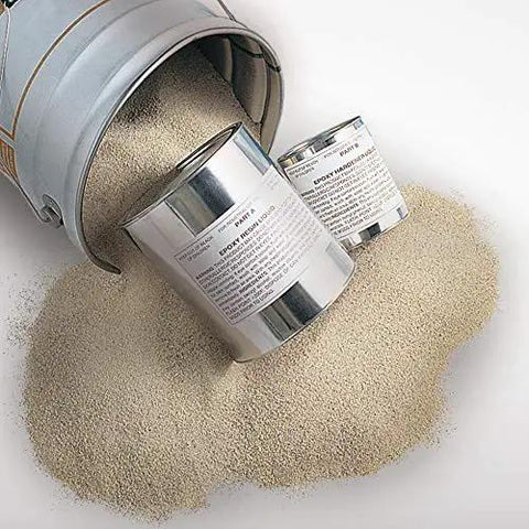 Quick Setting Epoxy Concrete Floor Patch Two Gallon Light Gray Rapid Cure Mix spilling from a tin can.