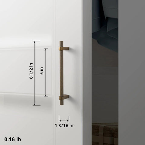 Side view of Six Pack 5 Inch Center To Center Knurled Antique Brass Cabinet Bar Handles With Blocky Triangular Mounts on a cabinet door