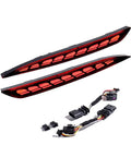 Slick All-In-One Rear Bumper Combo Lights For Tesla Model Y 2020-2023 featuring dual red lamp bars and plug harnesses.