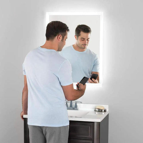 Man using LED Bathroom Mirror With Bluetooth Speakers Frameless Wall Mounted Vanity for music and grooming