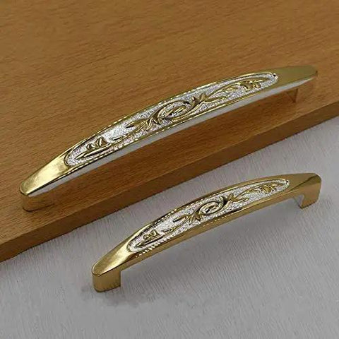 Top Shelf European Style Real Gold Tone Cabinet Pulls 128mm Heavy Duty Drawer Handles And Wardrobe Knobs Sharp Palace Design close-up on wooden surface.