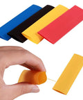 Hand holding yellow tube from Do It Yourself Friendly 328 Piece 2 To 1 Heat Shrink Tubing Kit With 8 Sizes And 5 Colors Assorted Sleeving Tube Wrap