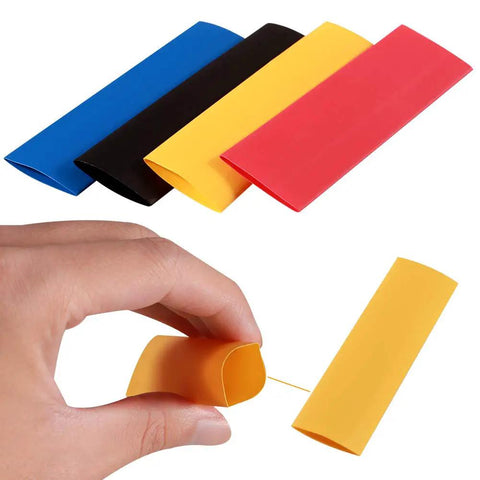 Hand holding yellow tube from Do It Yourself Friendly 328 Piece 2 To 1 Heat Shrink Tubing Kit With 8 Sizes And 5 Colors Assorted Sleeving Tube Wrap
