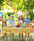 Children celebrating at a garden party with balloons and decorations, perfect setting for using Beginner Quilling Kit For Kids And Adults.