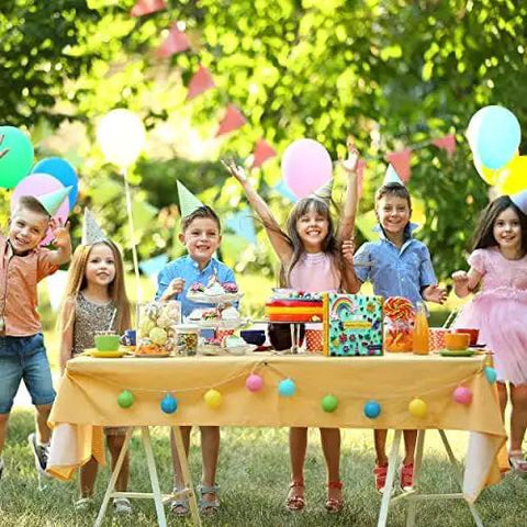 Children celebrating at a garden party with balloons and decorations, perfect setting for using Beginner Quilling Kit For Kids And Adults.