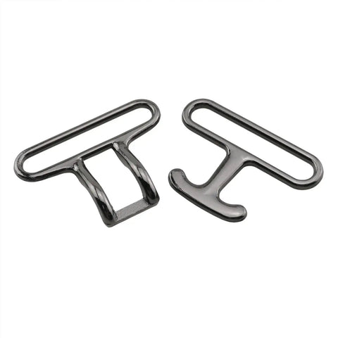 Four Piece 40mm Metal Clasp Buckle Set Quick Release Zinc Alloy Fasteners In Gun Black Dope Belt Buckles For Capes Scarves Jackets And Formal Wear Everyday Wear, shown close-up with two pieces.