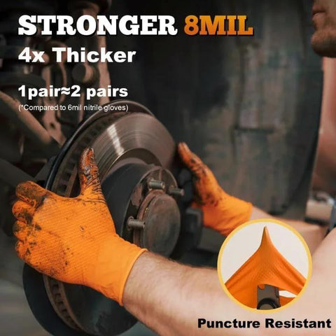 TitanFlex orange nitrile gloves, side view of gloved hands gripping a brake rotor with raised diamond texture grip