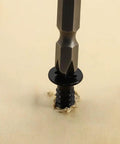 Badass Fifty Piece Kit Of Black 304 Stainless Steel Number 12 Flat Head Phillips Sheet Metal Screws Half Inch Length Job Site Ready Fastener Bundle being driven into wood.