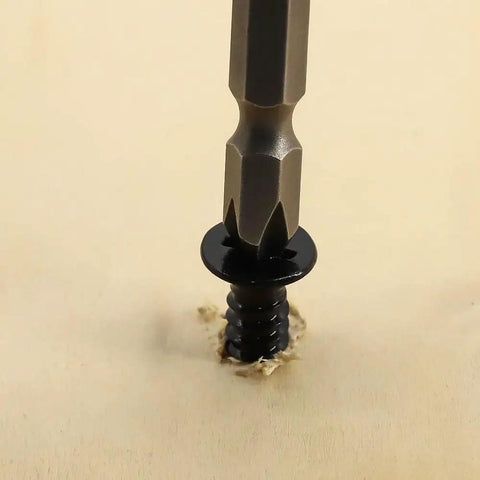 Badass Fifty Piece Kit Of Black 304 Stainless Steel Number 12 Flat Head Phillips Sheet Metal Screws Half Inch Length Job Site Ready Fastener Bundle being driven into wood.