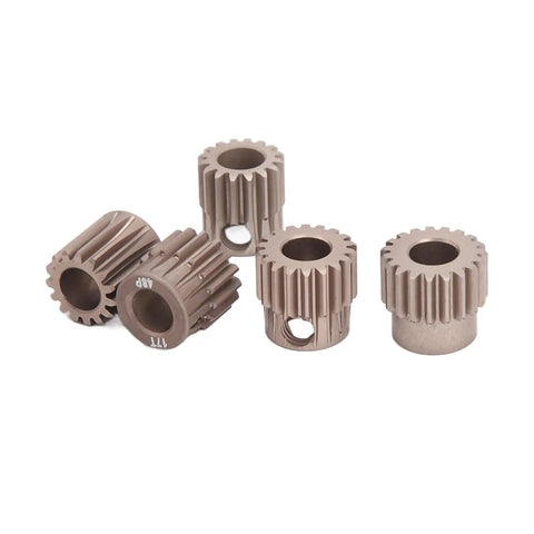 Set of five metal gears in varying sizes on white background