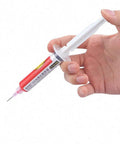 Hand holding red tube from Must Have Pro Grade Five Color UV Curable Solder Kit With Five Needles And Five Plastic Tube Pistons For PCB Protection