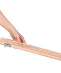 Hand holding a light yellow wooden drawer slide from the Two Pack Wooden Drawer Slides With Center Mount Bottom Track For Dresser Repair And Furniture Assembly Kicking Ass With Ez Glide Movement And Boss Grade Reinforced Tracks For Quick And Dirty Upgrades.