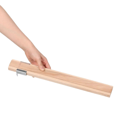 Hand holding a light yellow wooden drawer slide from the Two Pack Wooden Drawer Slides With Center Mount Bottom Track For Dresser Repair And Furniture Assembly Kicking Ass With Ez Glide Movement And Boss Grade Reinforced Tracks For Quick And Dirty Upgrades.