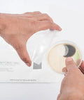 Person handling petri dish with mold sample next to prepaid mailer for DIY Air and Surface Mold Test Kit for Home Use With Prepaid Return Mailer and Expert Consultation, Fast Lab Analysis and Clear Results in Just 48 Hours