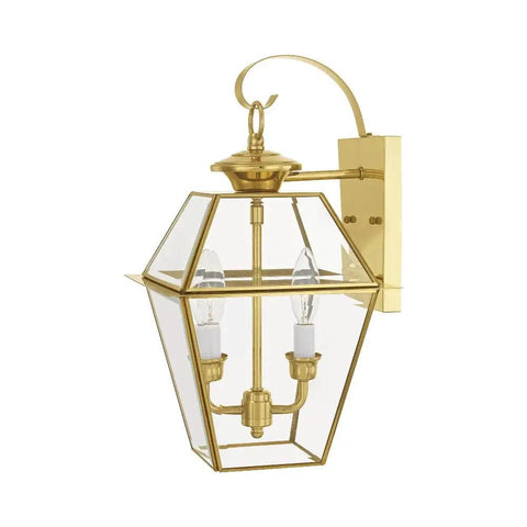 Outdoor wall lantern in brass with clear beveled glass and two lights, traditional sconce style.