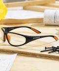 Bradford 3030 Series Nylon Protective Safety Glasses with 2.0 Bifocal Lens and Clear Lens Black Frame on workspace with screws