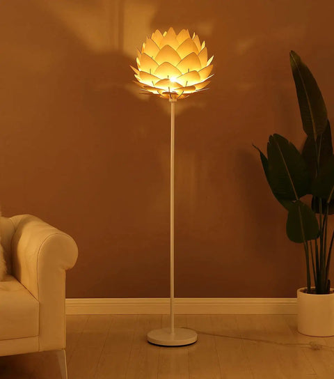 Artichoke Design 68 Inch Tall Free Standing LED Floor Lamp With Multi Panel Wooden Shade For Living Room Ambience A Modern Farmhouse Statement Piece And Slim Tall Pole Lighting With Warm Dimmable Glow in a cozy room corner lighting up a beige wall.