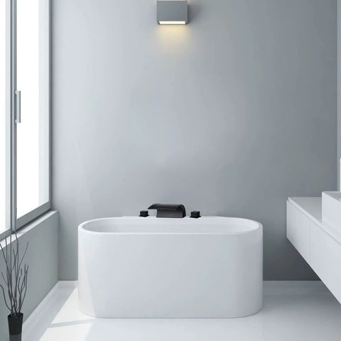 Matte Black Waterfall Tub Faucet With Widespread Spout, Deck Mount Roman Tub Filler, Solid Brass 2-Handle Bathroom Faucet in a modern bathroom