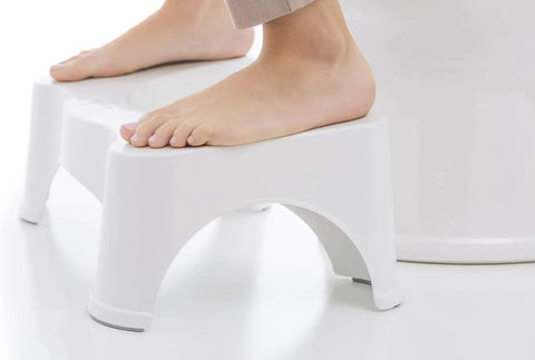 Person using 7 Inch Toilet Stool For Killer Bathroom Posture And Comfort White, Ergonomic Stand For Standard Toilets As Seen On Shark Tank