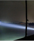 Badass 50W LED Flood Light, IP65 Waterproof Spot Searchlight With Remote Dimmer illuminating water and boats at night.