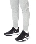 Man wearing Precision 5 Black White Men Basketball Shoes Engineered For Explosive Speed And Tight Feel Lightweight Breathable Upper.