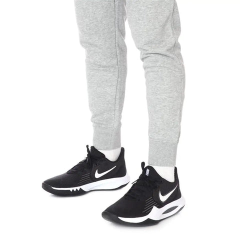 Man wearing Precision 5 Black White Men Basketball Shoes Engineered For Explosive Speed And Tight Feel Lightweight Breathable Upper.