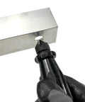General Tools hand reamer and countersink, short length, 3/4 in, black-handle bit positioned at metal block hole