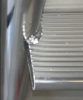 Five Step Flip Up Dock Ladder With Welded Aluminum Construction, 4 Inch Tread Depth, Rugged 665 Pound Capacity For Easy Water Access On Seawalls, Docks, And Boats. Close-up of welded aluminum tread and rail