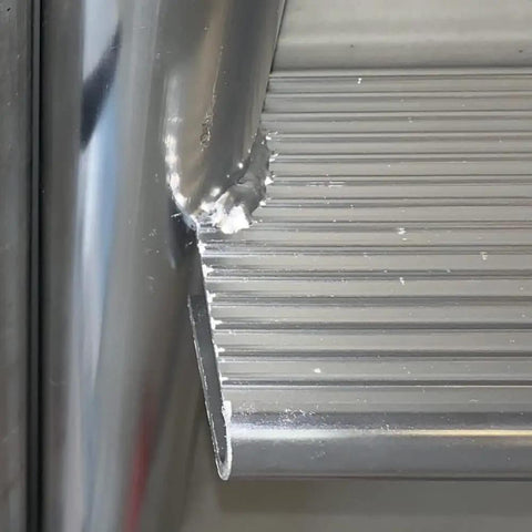 Five Step Flip Up Dock Ladder With Welded Aluminum Construction, 4 Inch Tread Depth, Rugged 665 Pound Capacity For Easy Water Access On Seawalls, Docks, And Boats. Close-up of welded aluminum tread and rail