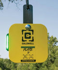 Flash Bang Pro Target Hit Indicator With Impact Light System on AR500 plate outdoors with LED feedback, for shooting practice.