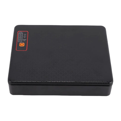 Never Sweat Another Power Outage Again As This Heavy Duty Uninterruptible Power Supply For Routers And Modems Packs A Massive 12000 Mah Backup Battery. Black UPS unit with control panel and status indicators.