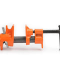 Side view of Six Pack Adjustable Clamp Fixture For Half Inch Black Pipe, orange metal clamp on a black pipe for woodworking projects.