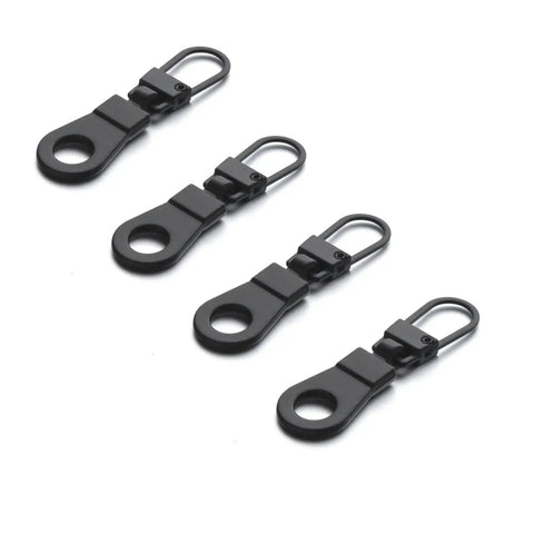 Four black pieces from the Handy Zipper Pull Replacement Kit For Small Holes With Detachable Tabs, Easy Install, Reusable Repair