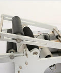 Close-up view of Semi Auto Round Bottle Labeling Machine For 15-30 Pcs Per Minute Speed with rollers and aluminum alloy frame.