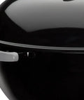 Side view of Original Kettle Charcoal Grill 22-Inch Black With One-Touch Cleaning System, showing durable enamel lid.