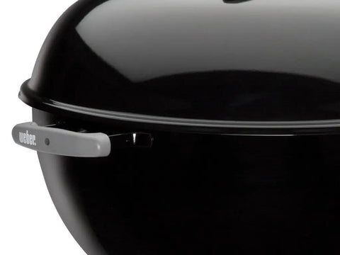 Side view of Original Kettle Charcoal Grill 22-Inch Black With One-Touch Cleaning System, showing durable enamel lid.