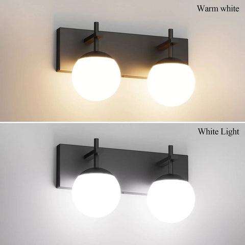 Matte Black Two Light Bathroom Wall Light Fixtures With Milky Glass Globes Sleek Mid Century Modern Vanity Lighting For Bathrooms 14 Inch Long 6.3 Inch Projection G9 Bulb Compatible showing warm and white light.