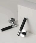 Lychee Skin Door Lock Set In Black Brass Finish With Modern Style Dummy Handle displayed at an angle
