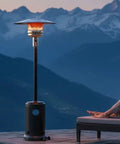 50,000 BTU Outdoor Propane Patio Heater With Wheels, Durable Powder Coated Steel, on mountain patio at dusk